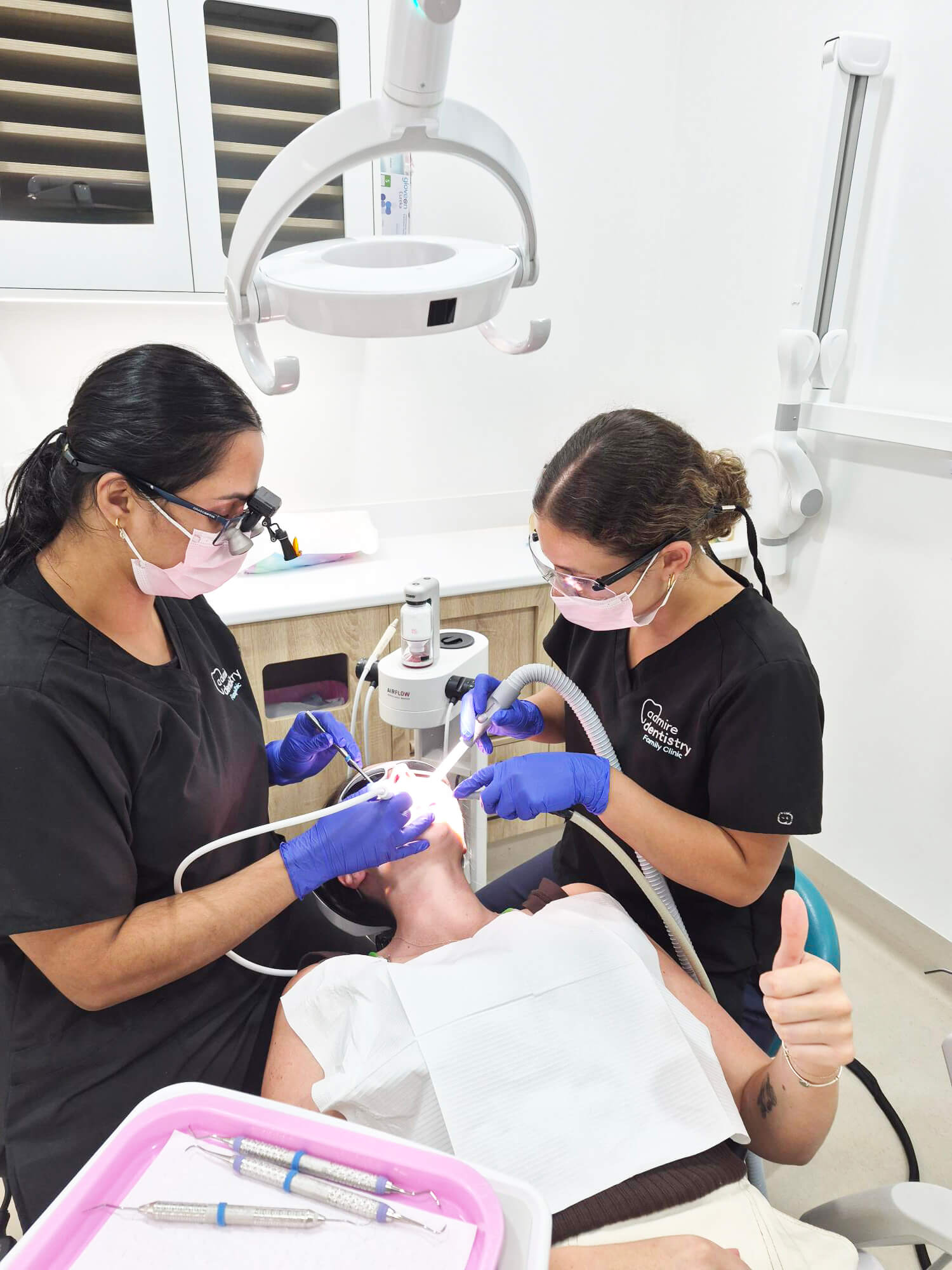 Oral Health Therapist Priyanka providing expert dental care and preventative treatment for a patient at Admire Dentistry Arana Hills.